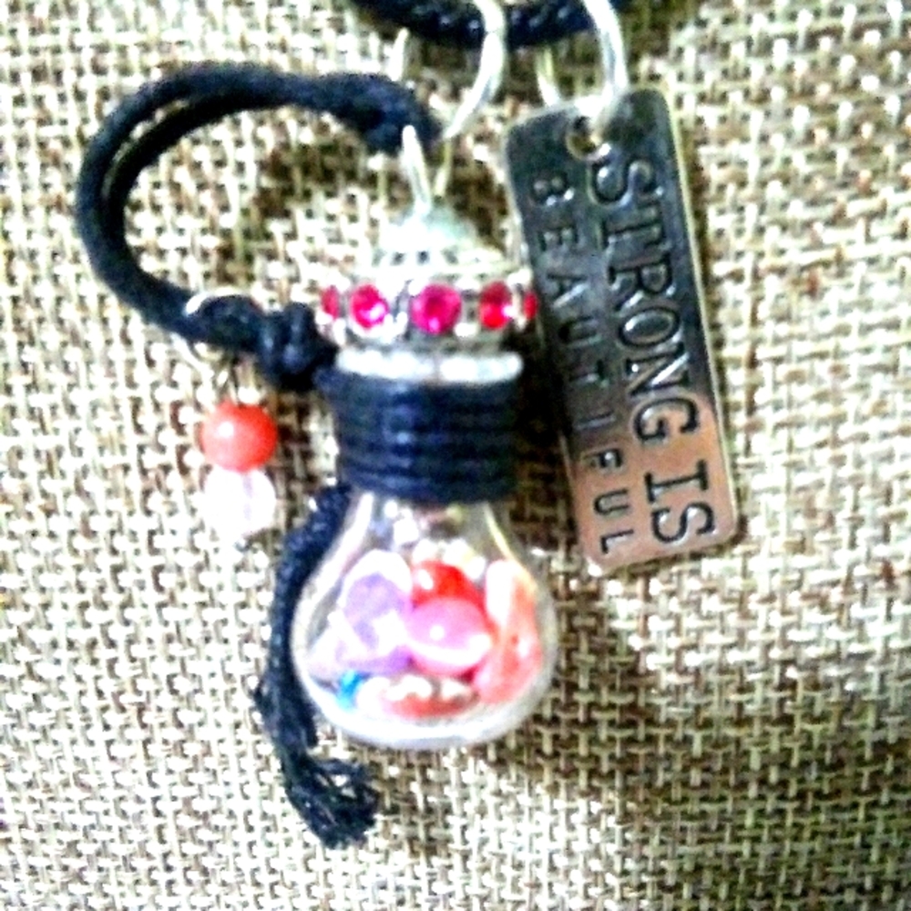 Bottle with gemstones, coral, cherry quartz beads.